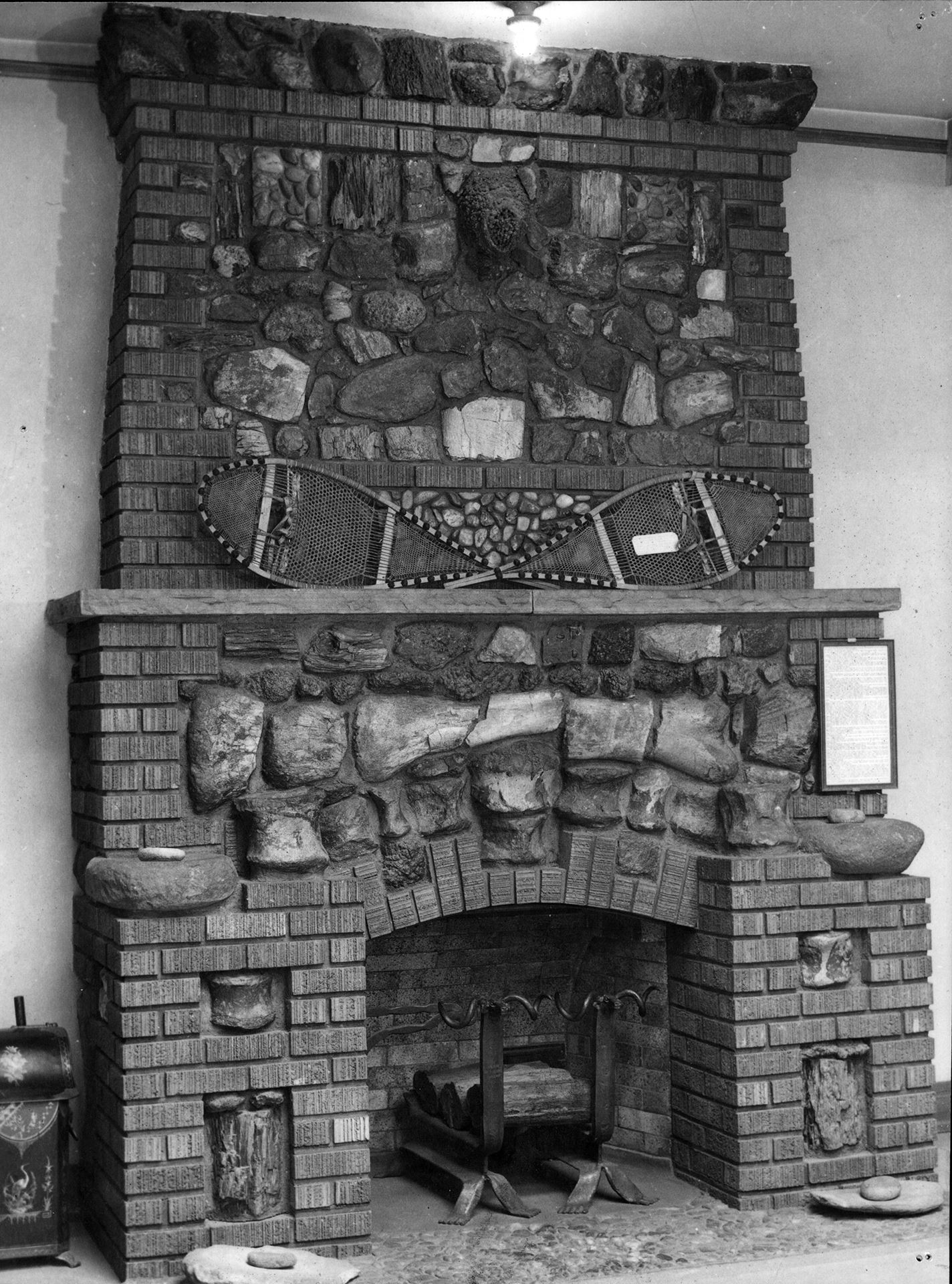 Black and white photo of DeWeese Fireplace constructed with artifacts. Photo circa 1920s.