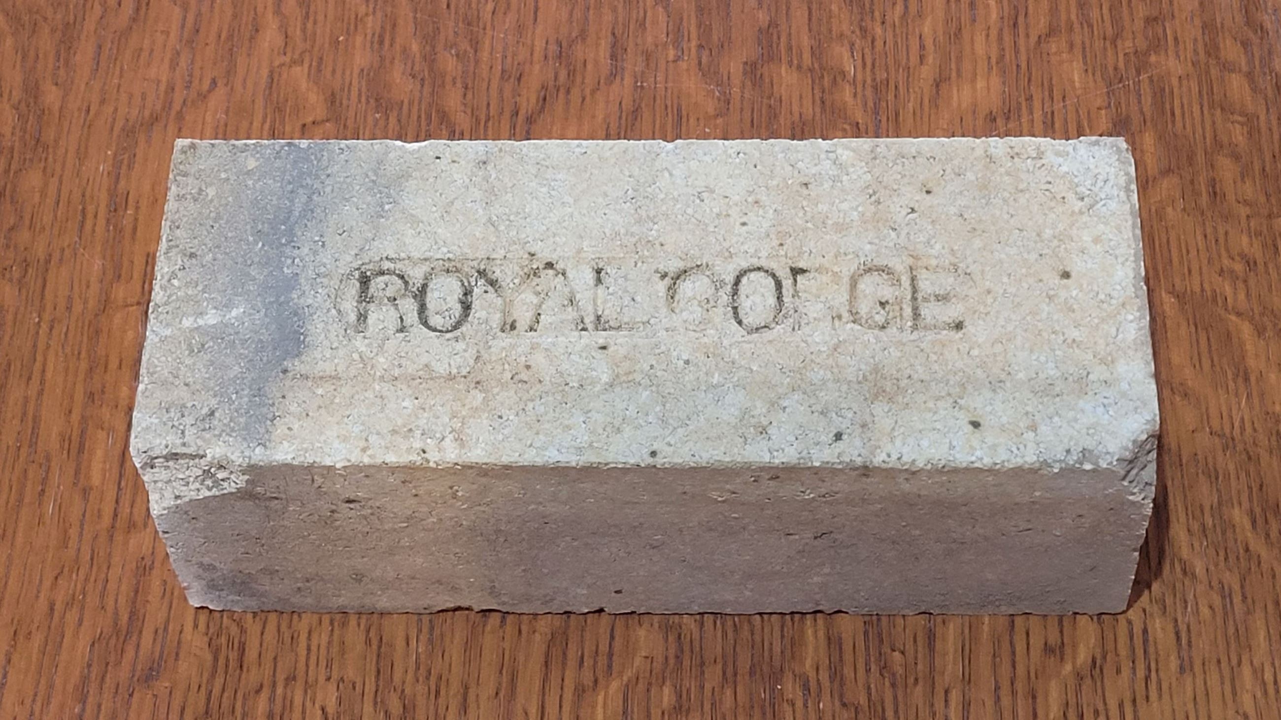 Photo of a Royal Gorge brick artifact.  Brick is stamped with words \"Royal Gorge\".
